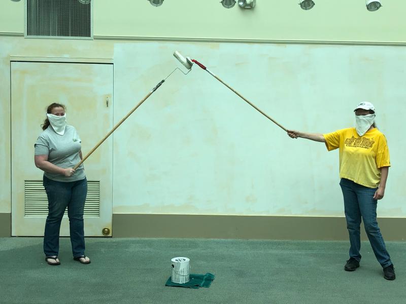 Observing social distancing and safety protocols while painting are Delaware Agricultural Museum Director Carolyn Claypoole and Operations Assistant Sara Busker. SUBMITTED PHOTO